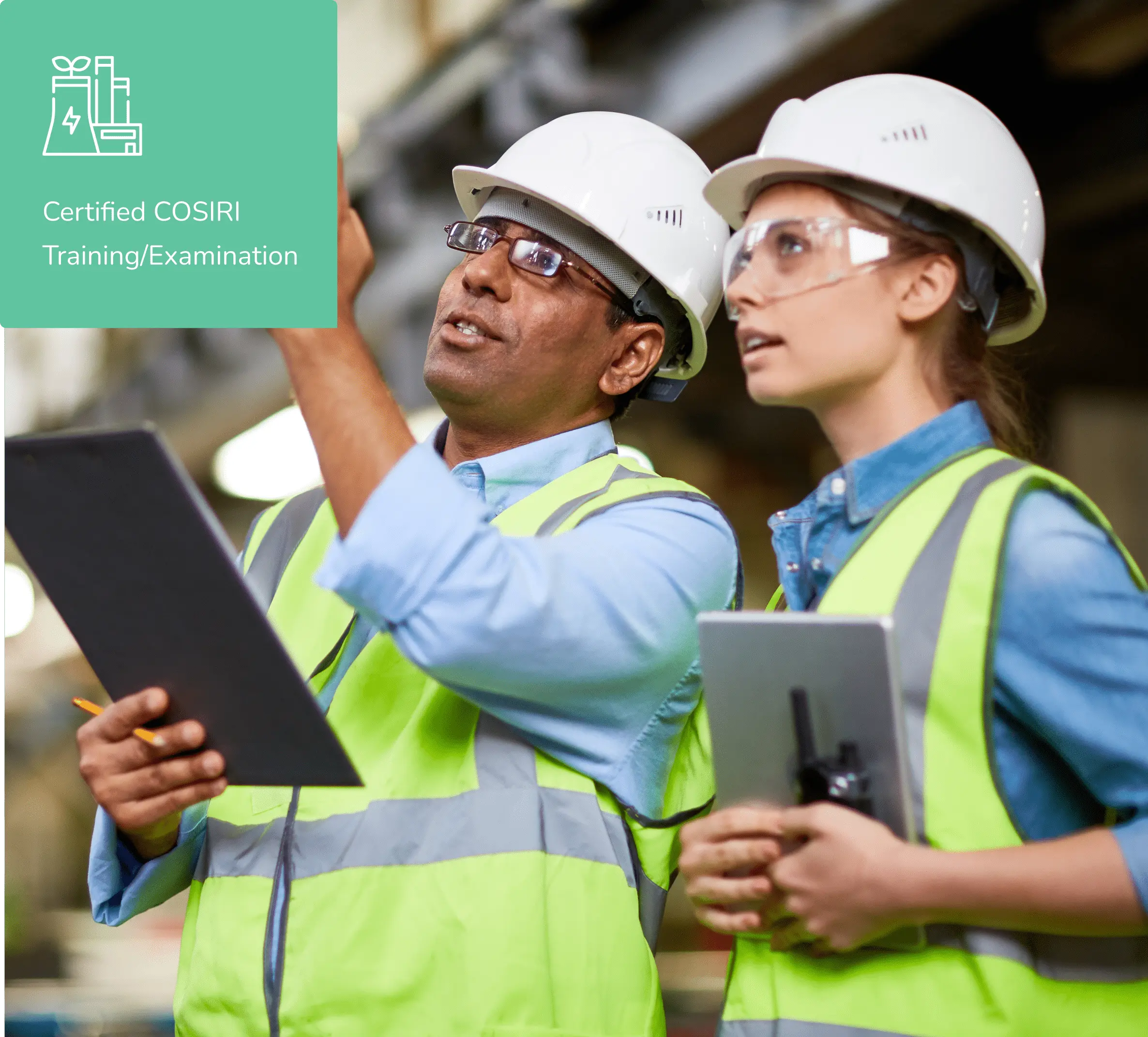 Two people in hard hats and vests are performing an industry readiness inspection.