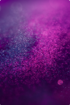 Gradient of purple and pink hues with sparkling bokeh effect.